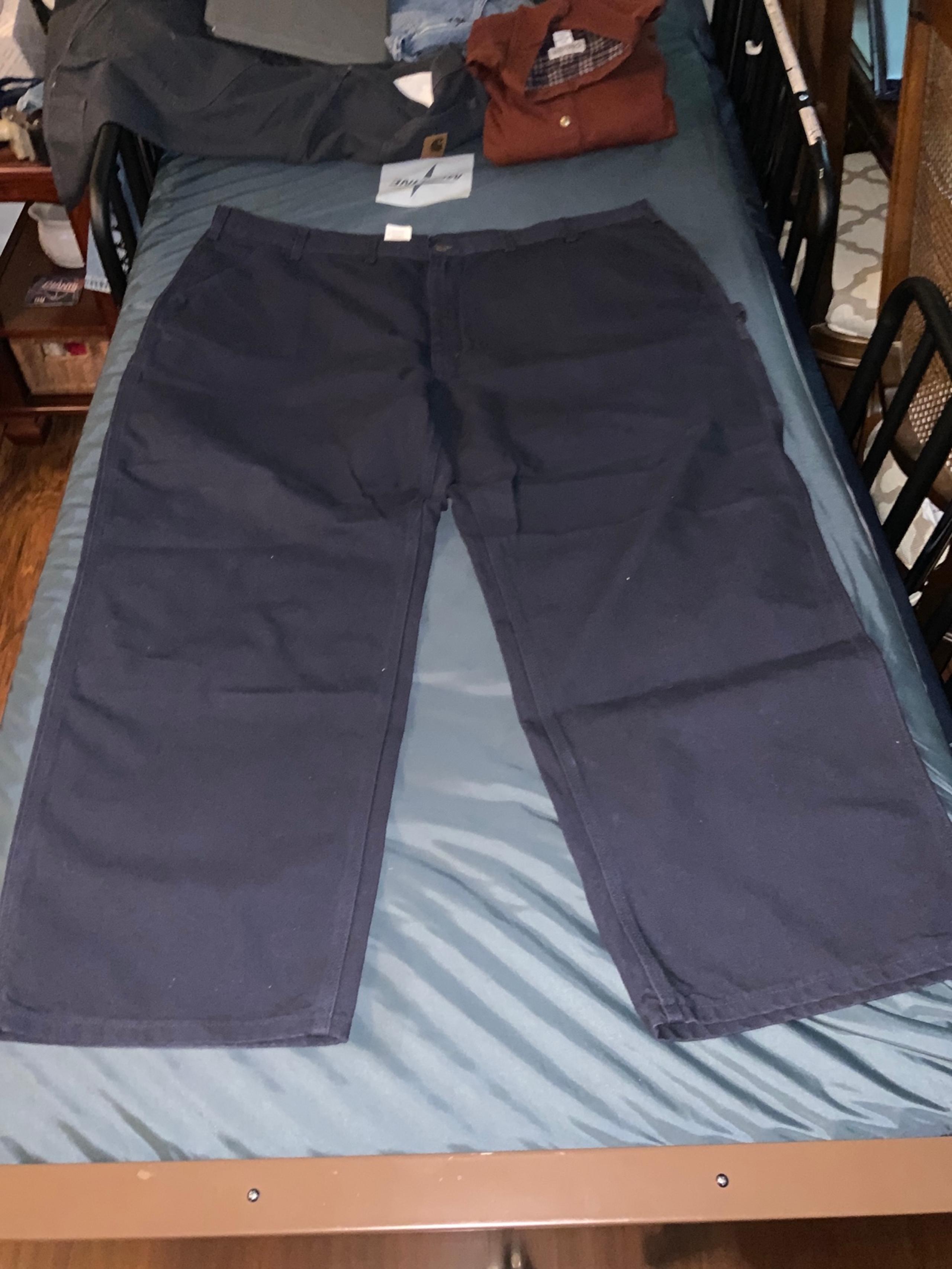 A BARELY USED PAIR OF CARHARTT BIG MAN JEANS