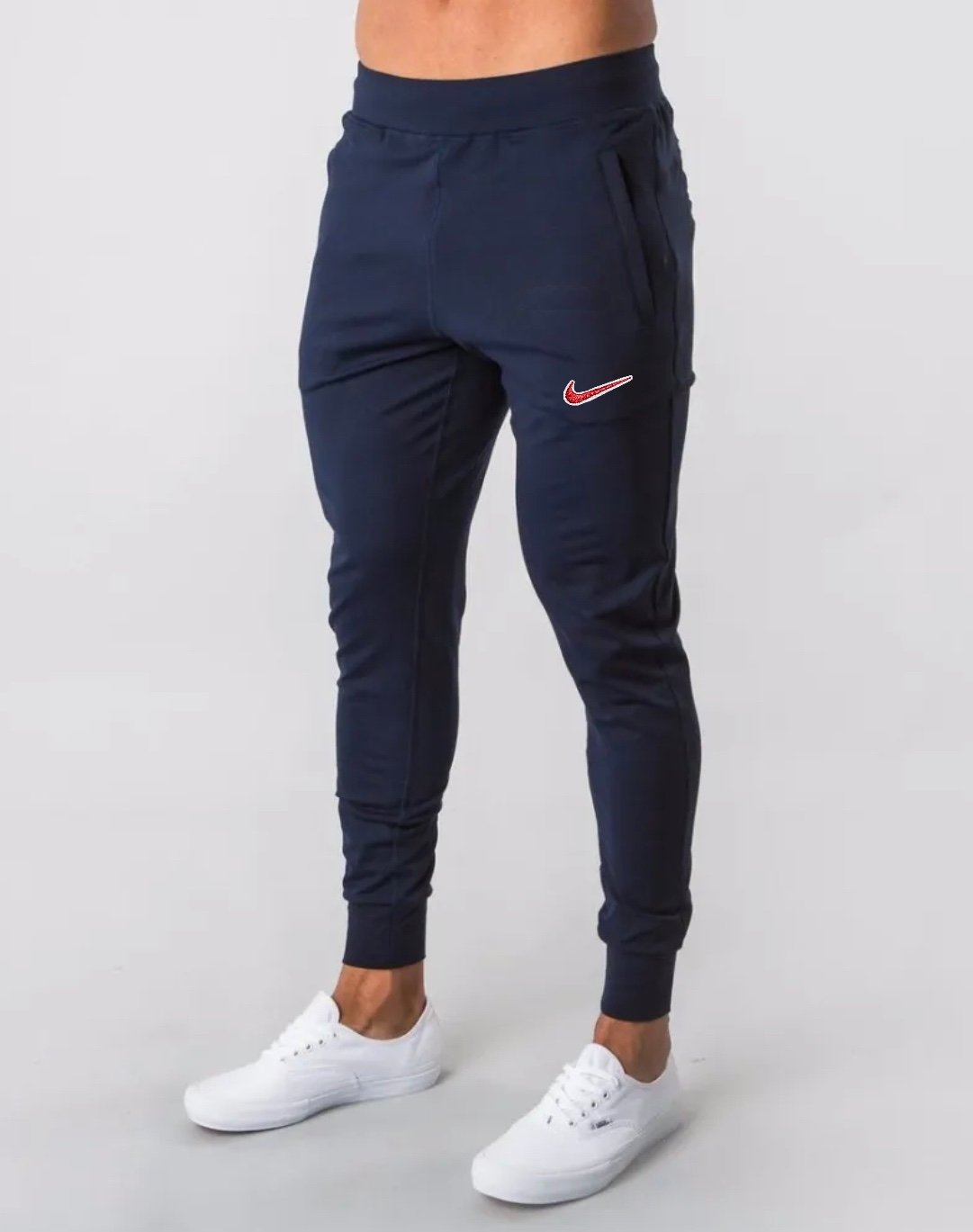 Nike Bootleg Alphalete® Tech Knit Slim Fit Taper Leg Joggers in Cerulean Blue Ⓜ