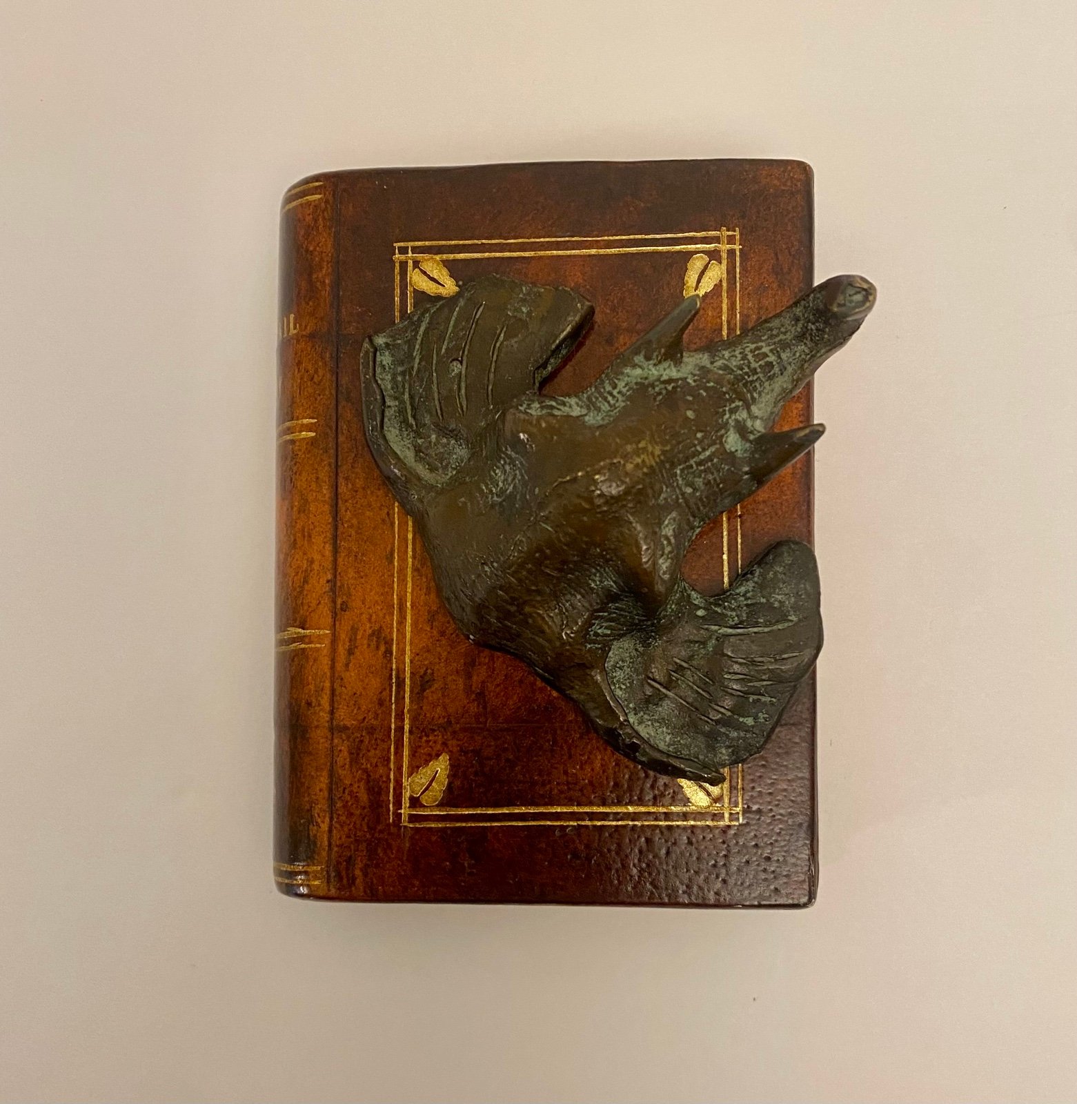 Maitland-Smith Faux Leather Wooden Book with a Bronze Elephant Paperweight.