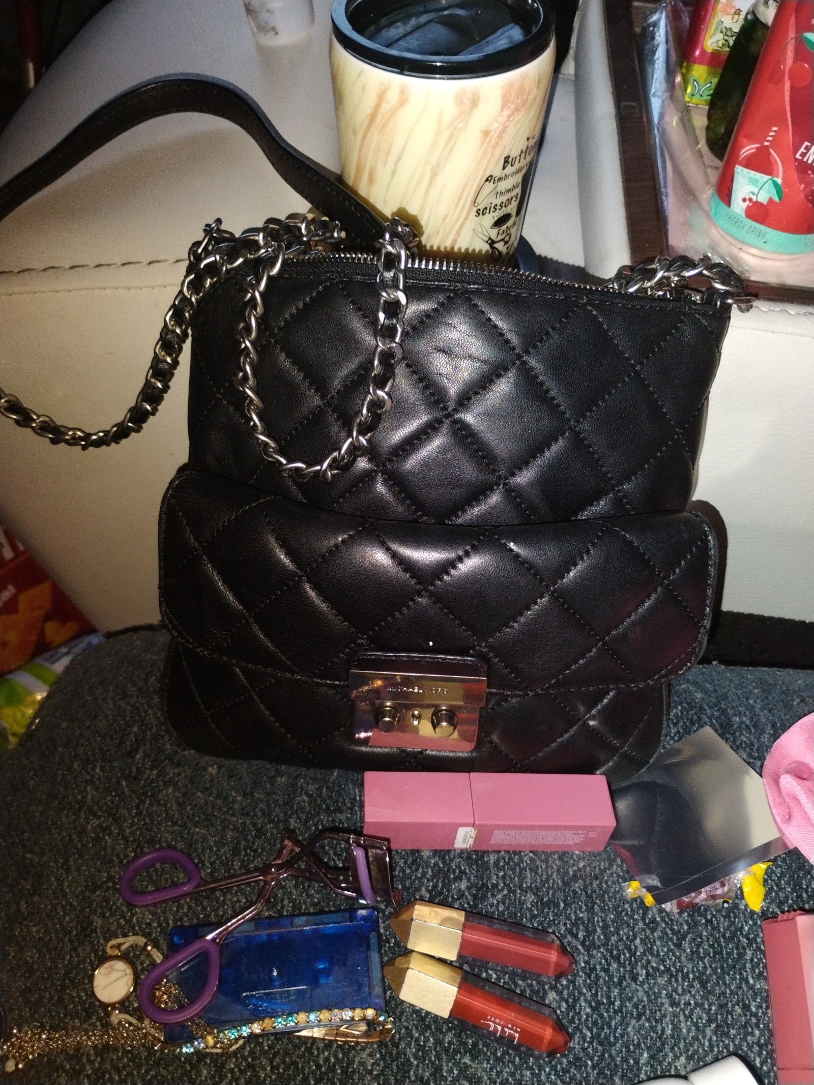 Black crossbody Michael Kors Sloan Purse and Michael Kors mini black wallet.