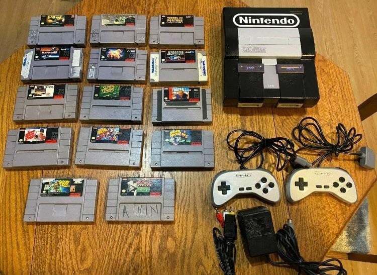 snes console with controllers and game