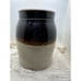 Brown and white stoneware crock