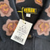 ♦︎Unused Faller Polo Shirt, Black with a subdued brown floral pattern.