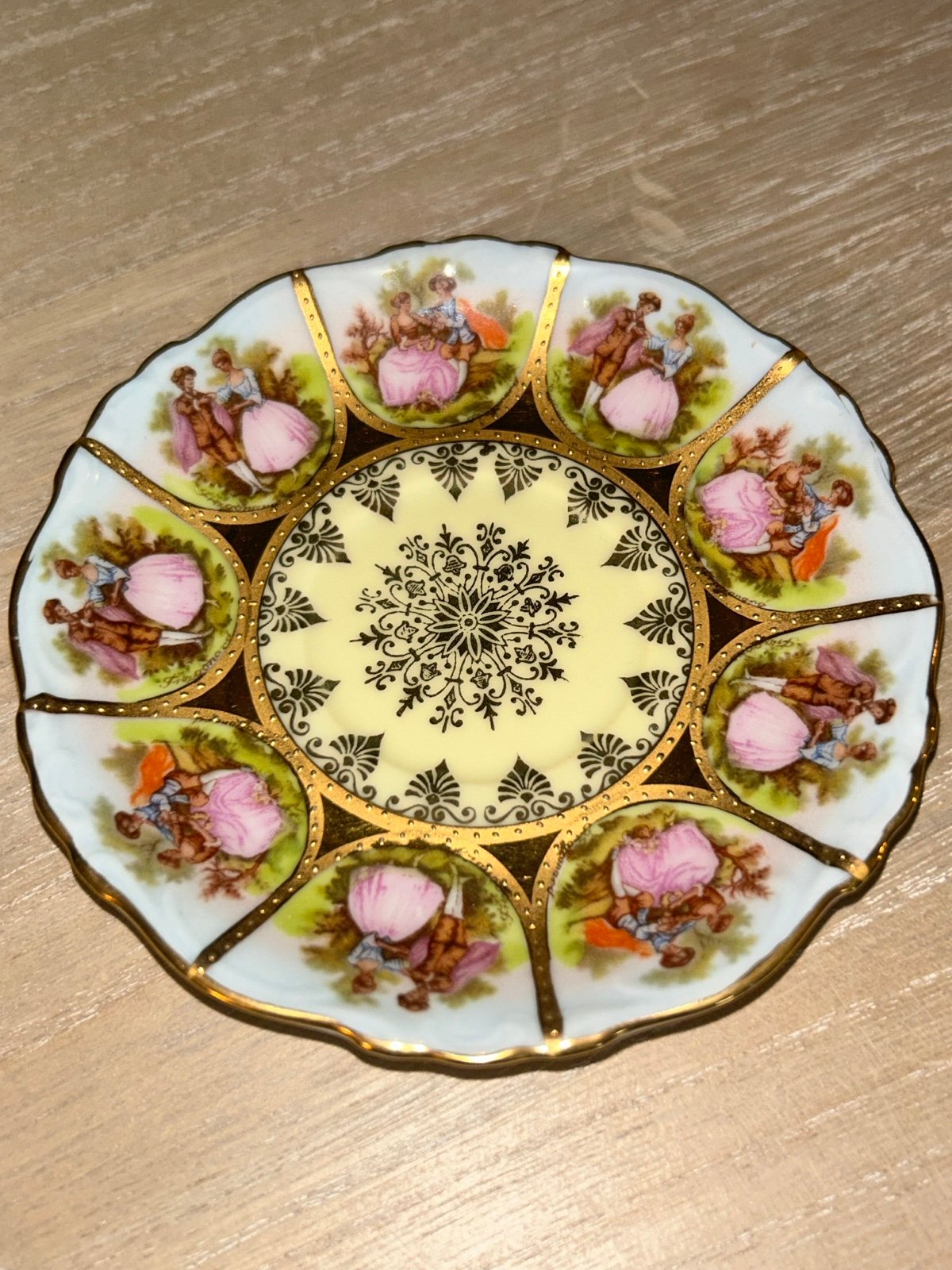 This exquisite 4.5” saucer from NC features a beautiful hand-painted design.