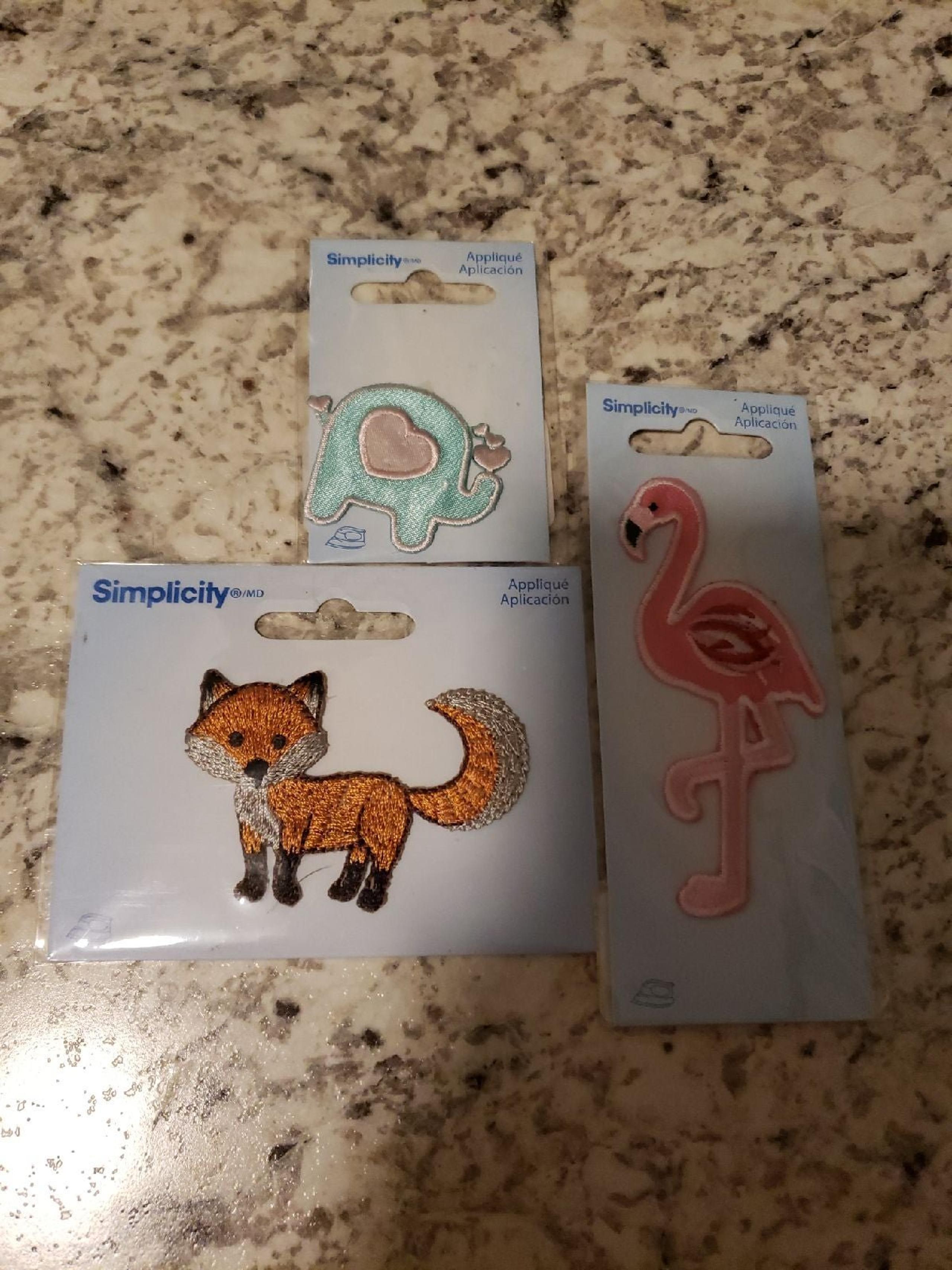 3 sew on patches - Simplicity