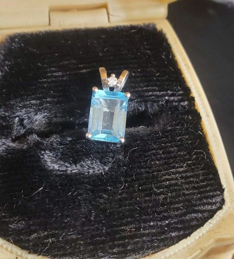 10k white gold blue topaz & diamond pendant! Great for someone who already has a