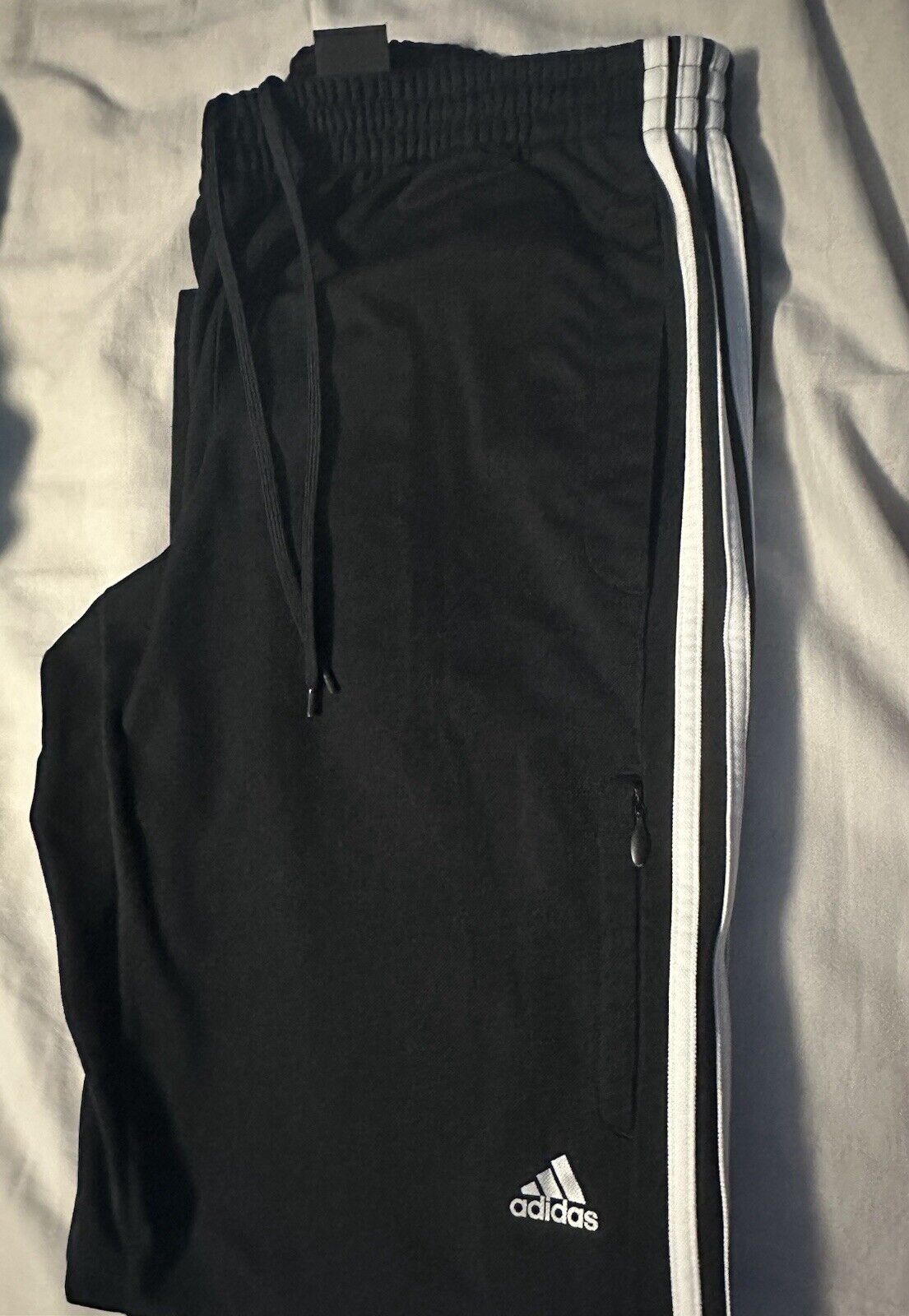 adidas Men Essentials 3-Stripes Track Pant - Black, Size M. Zipper Pockets