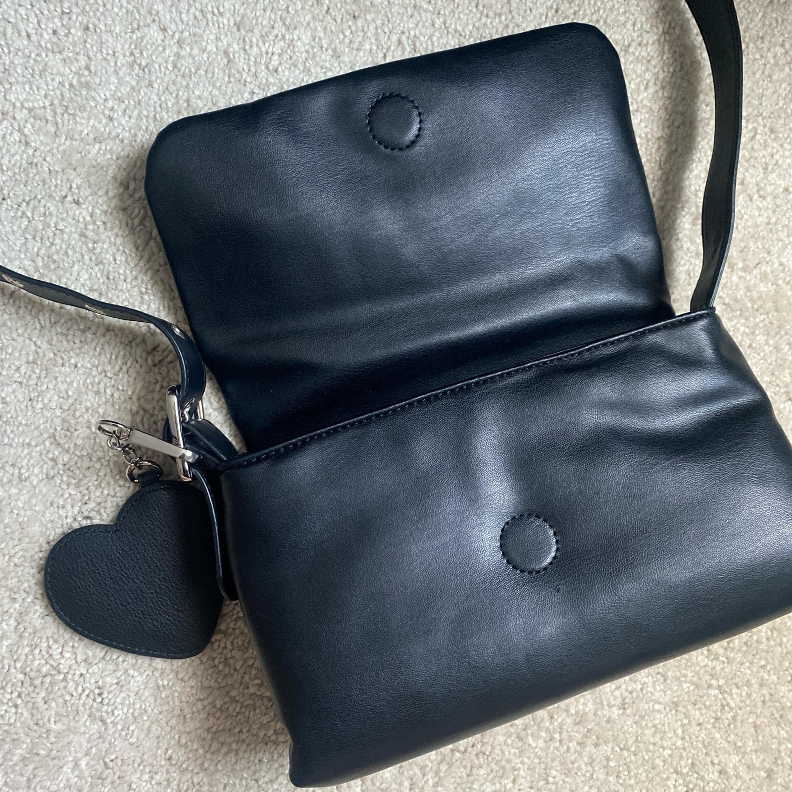 Black leather Madden Girl crossbody bag with heart charm