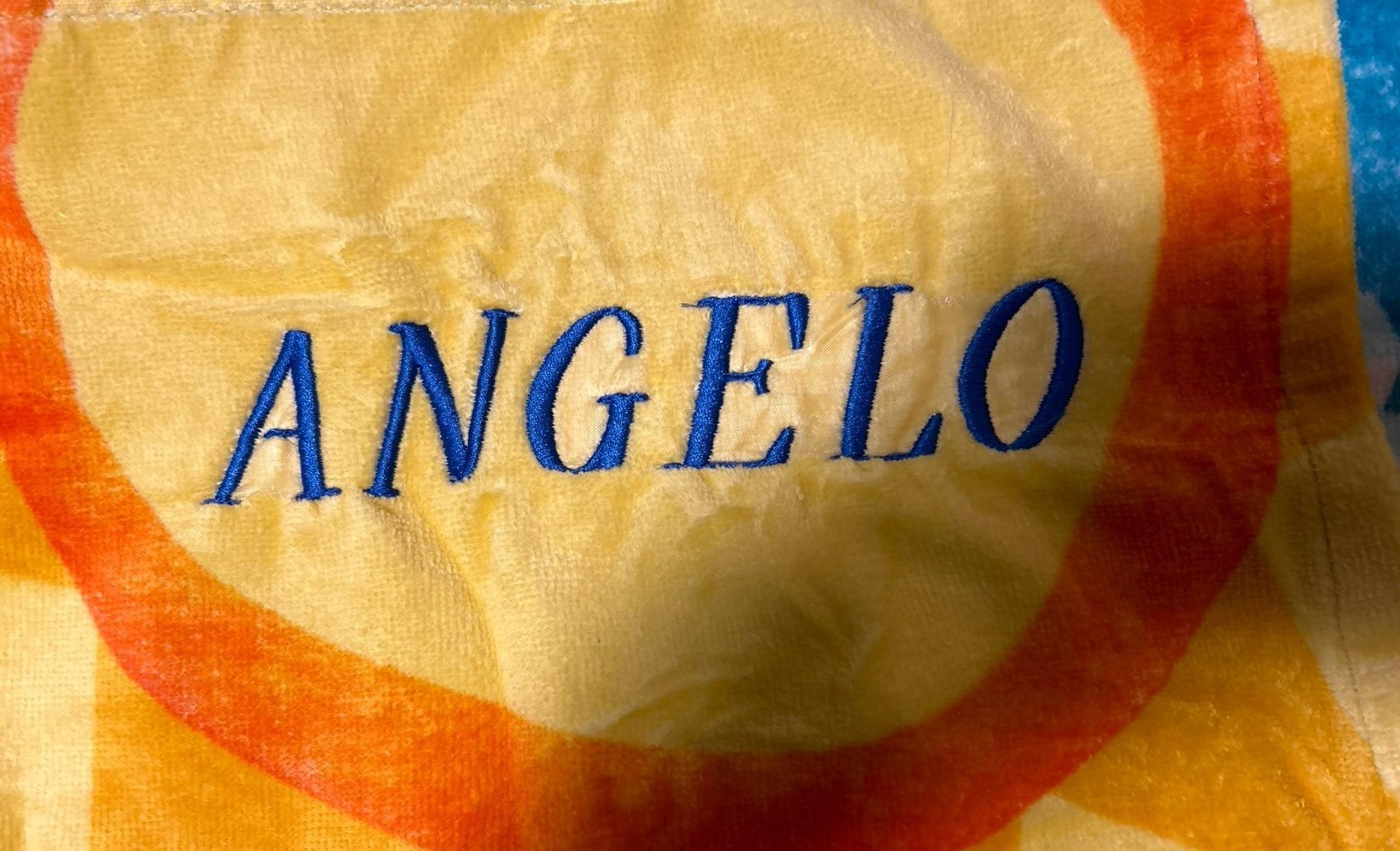 Brand new Olaf beach towel personalized with the name Angelo