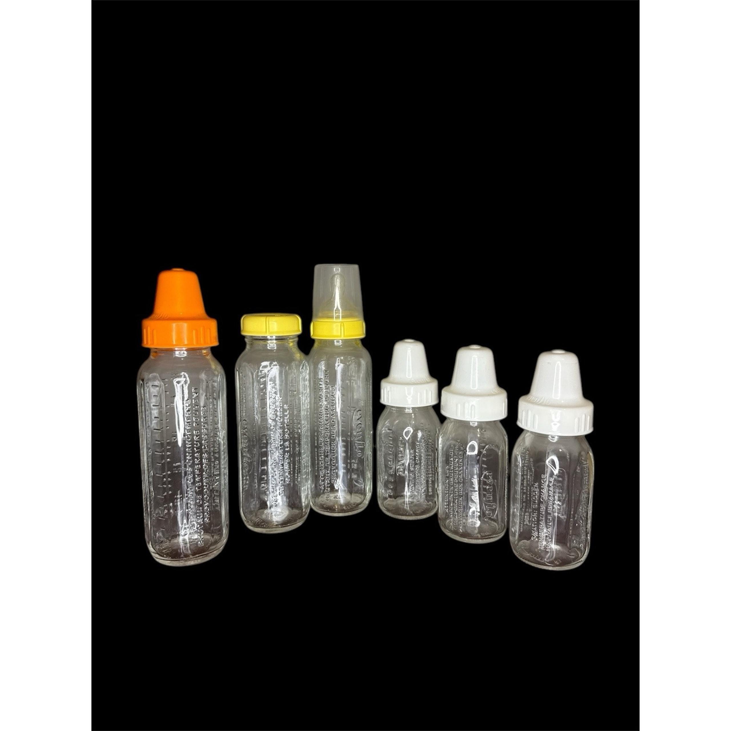 Lot of 6 Vintage Evenflo 8 +4 oz. Glass Baby Bottles with Some Nipples /Caps