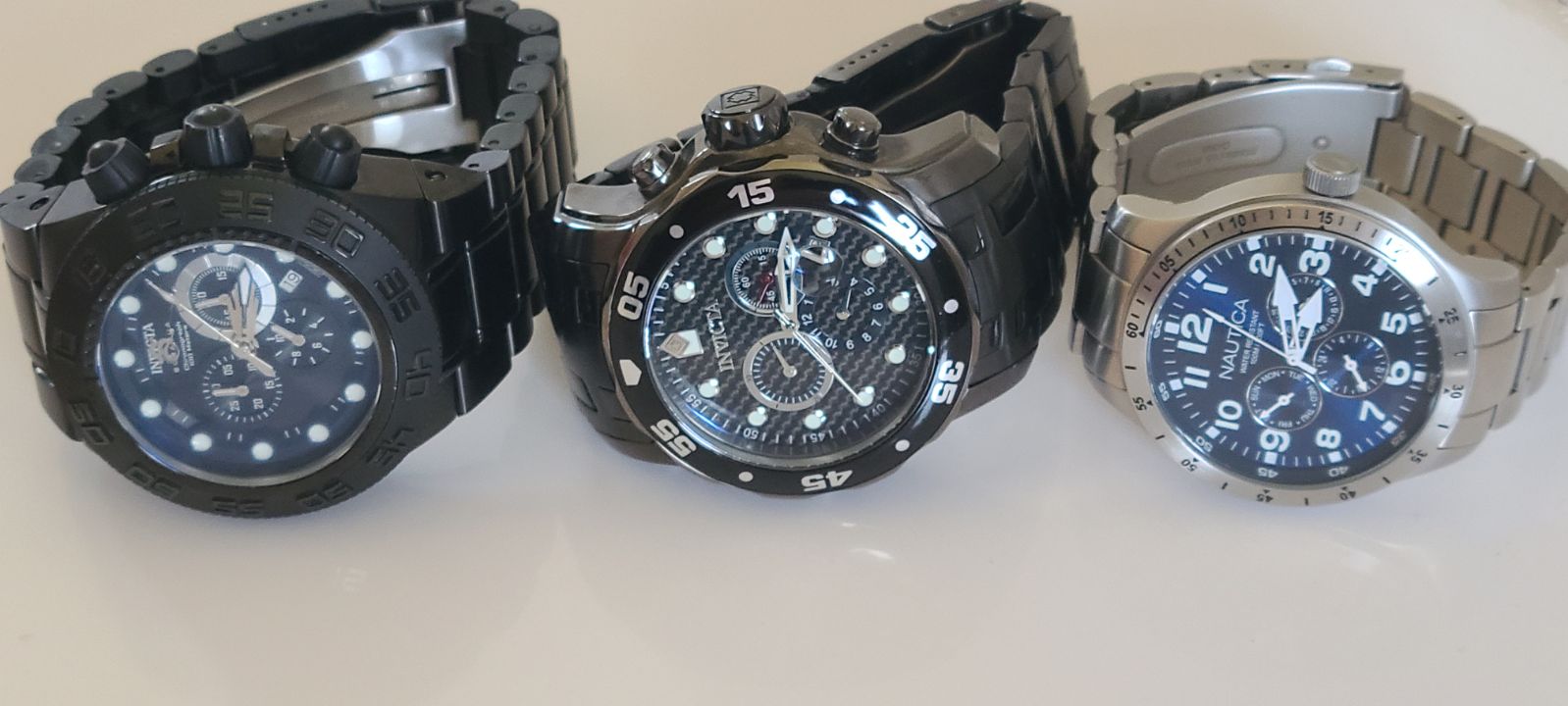 two, INVICTA Originals and a NAUTICA