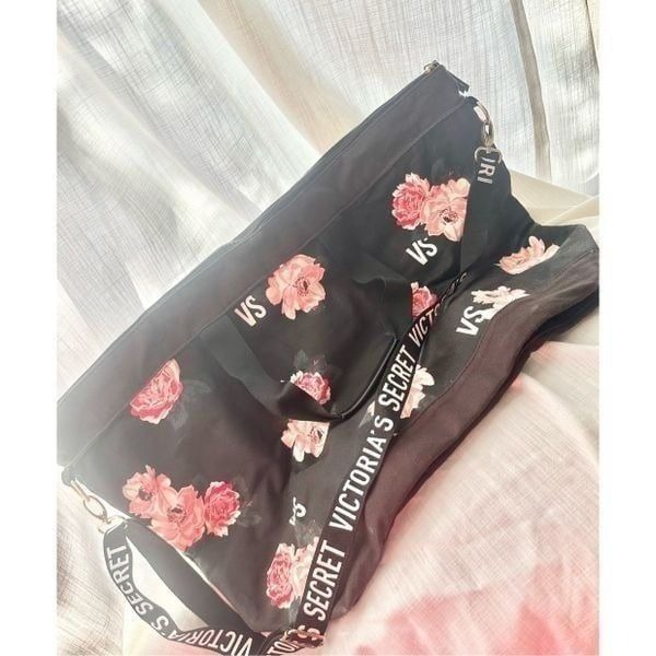 Victoria’s Secret black and Rose duffel bag