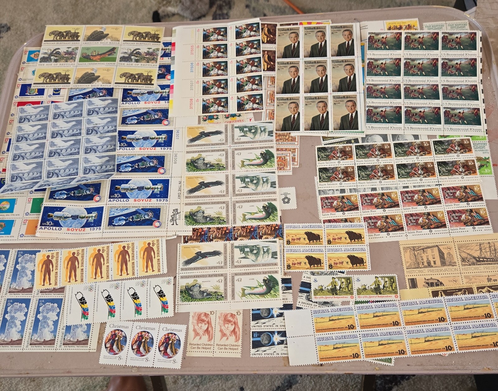 Huge lot of vintage unused US Postal stamp sets and blocks