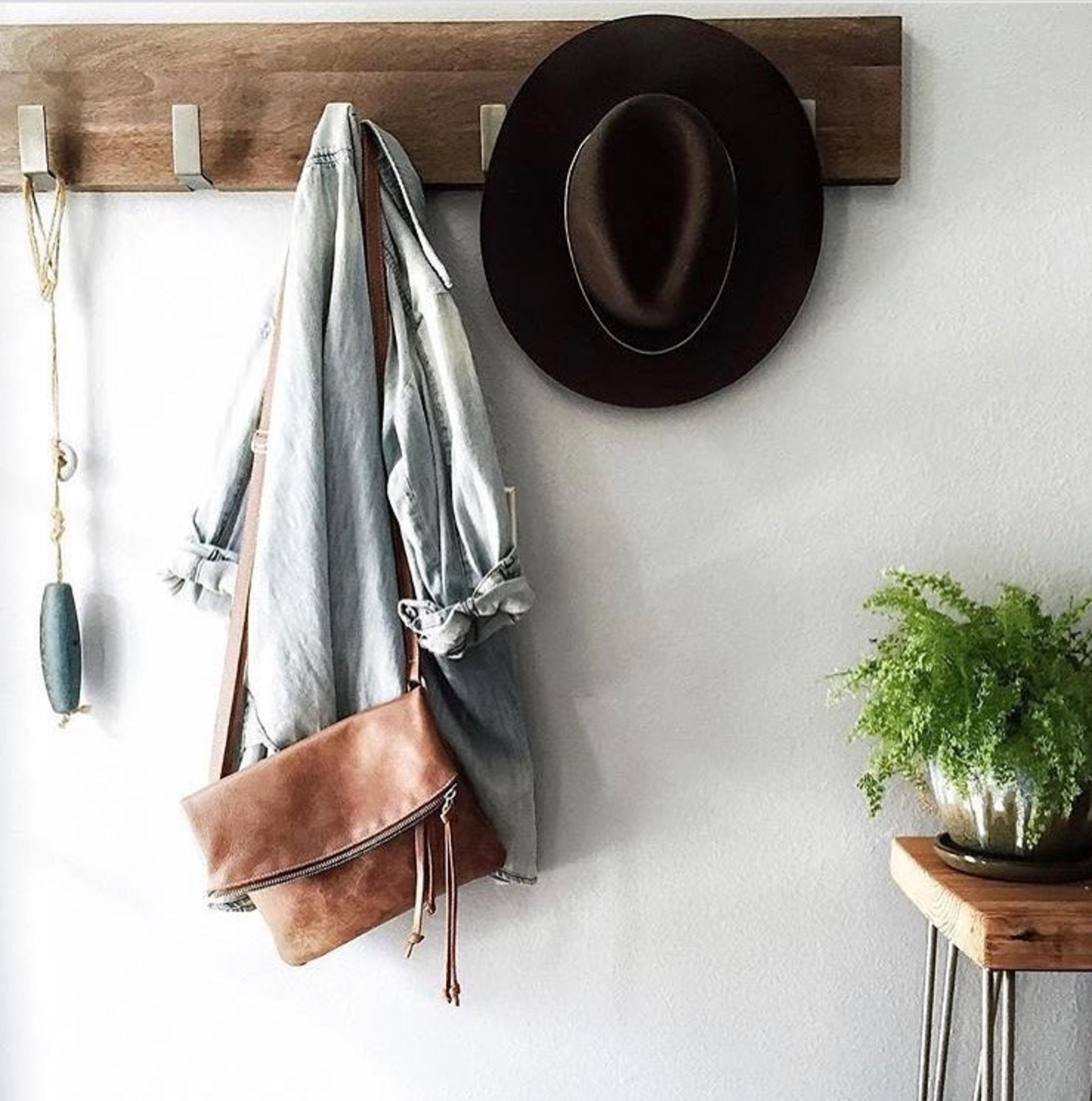 Roots fold over shoulder bag