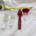 Towle Crystal Wine Stoppers and 2 signed Oleg Cassini one red unsigned lot of 5