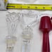 Towle Crystal Wine Stoppers and 2 signed Oleg Cassini one red unsigned lot of 5
