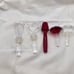 Towle Crystal Wine Stoppers and 2 signed Oleg Cassini one red unsigned lot of 5