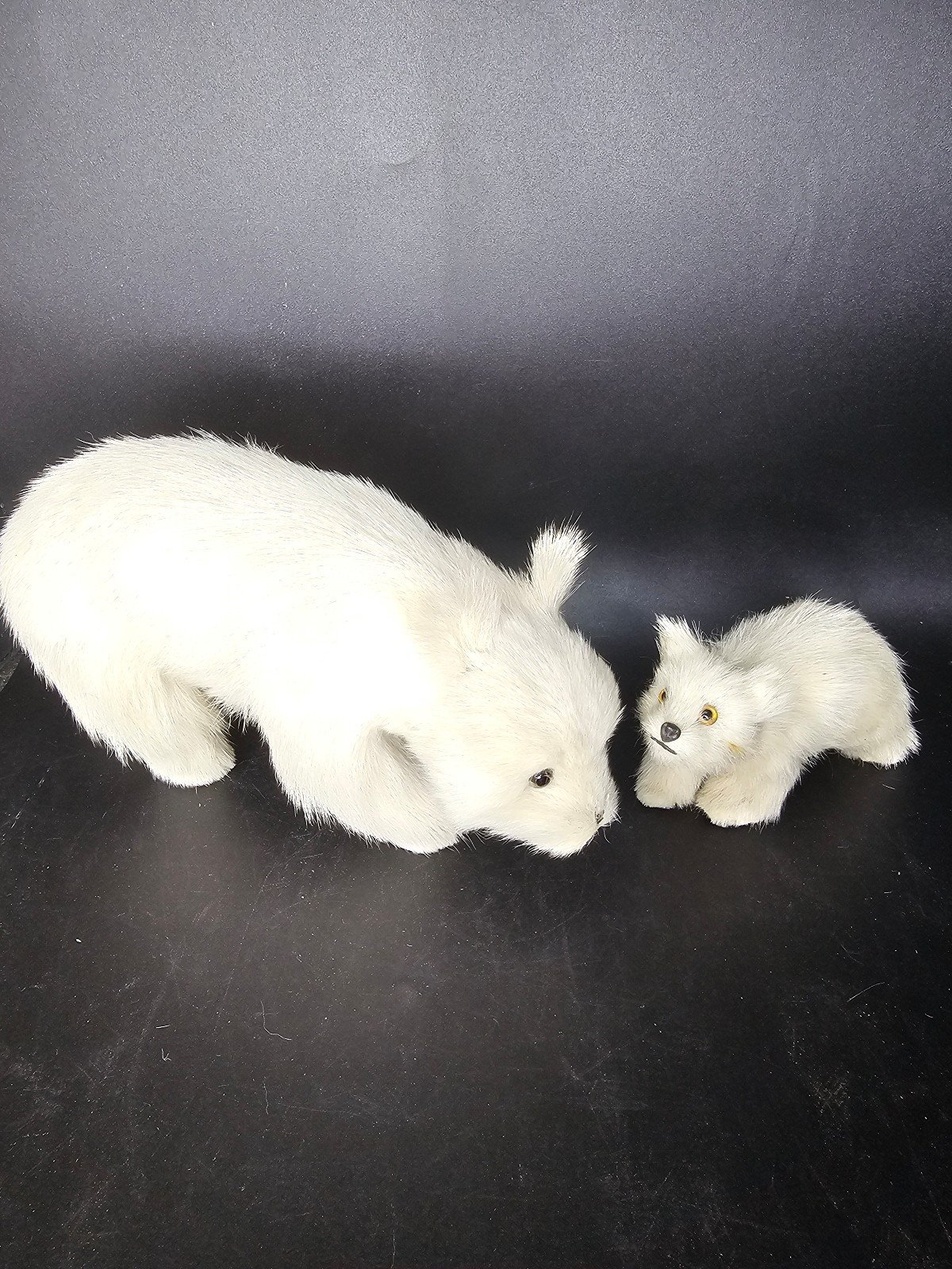 Vintage stuffed mother polar bear with her cub, with real fur