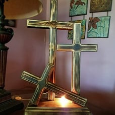Laying down cross with night lights.