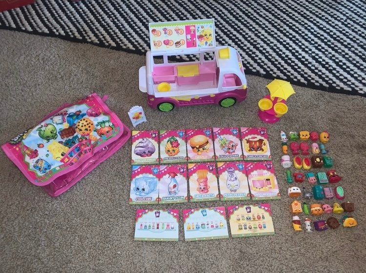 Shopkins Ice cream truck, collector cards, tables, storage bag, and 36 shopkins