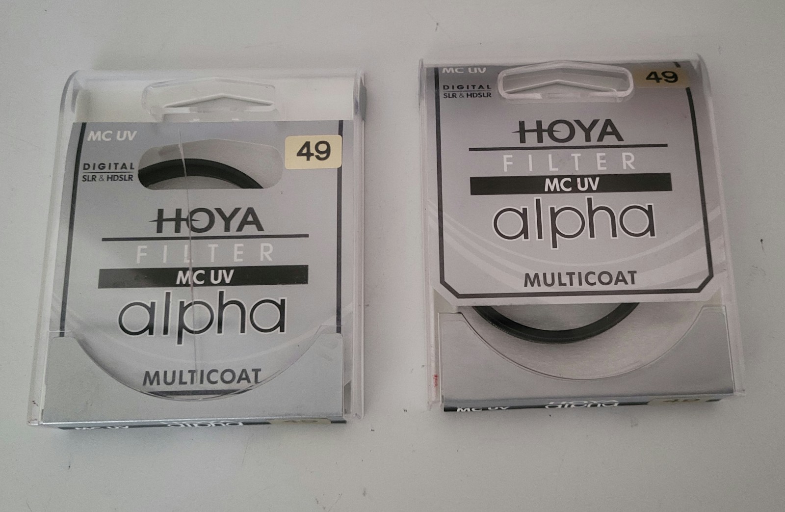 SET OF TWO NEW Hoya 49mm Alpha Multi-Coated UV Optical Glass Filter