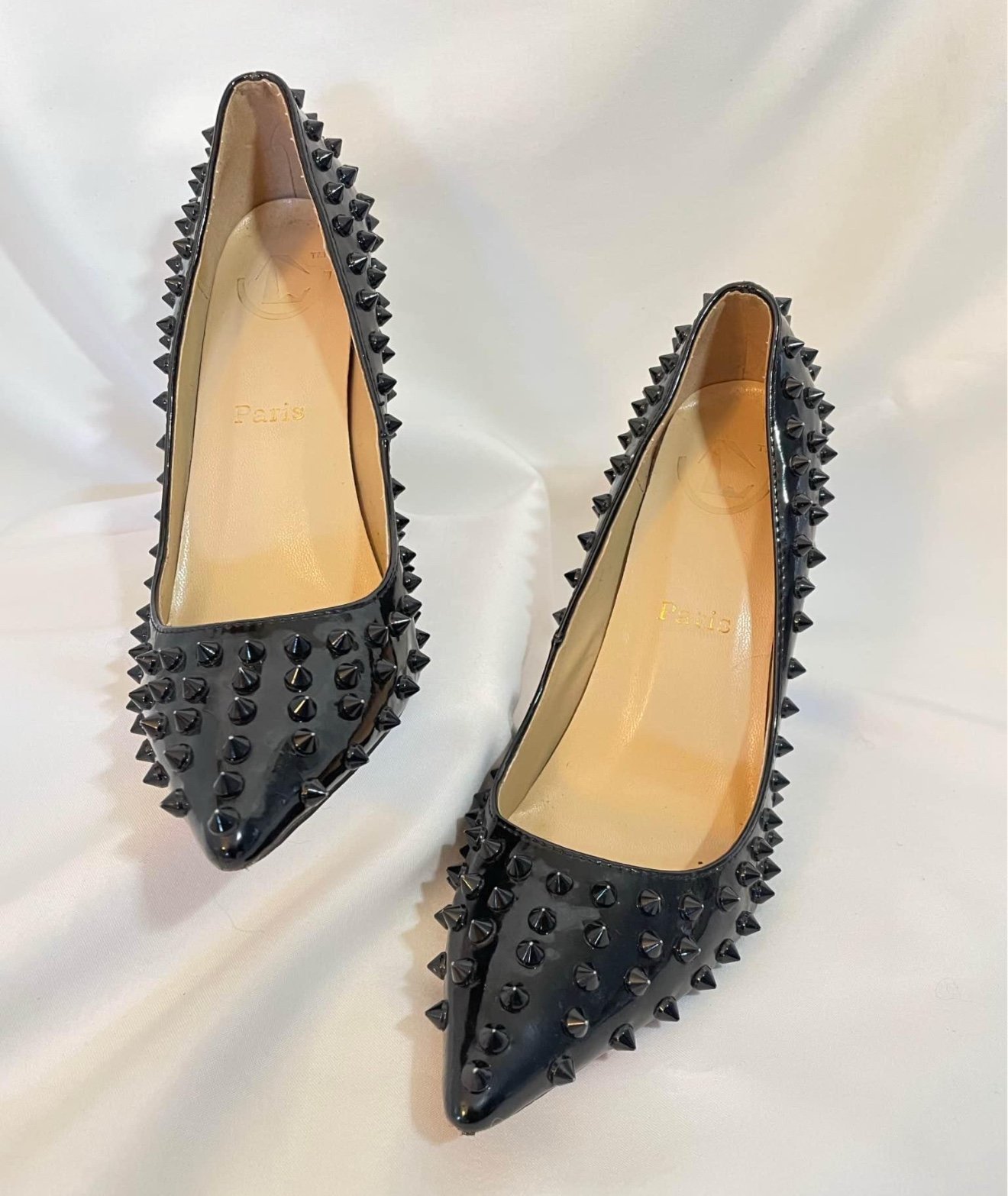 Pigalle spike patent leather heels by Christian Louboutin.