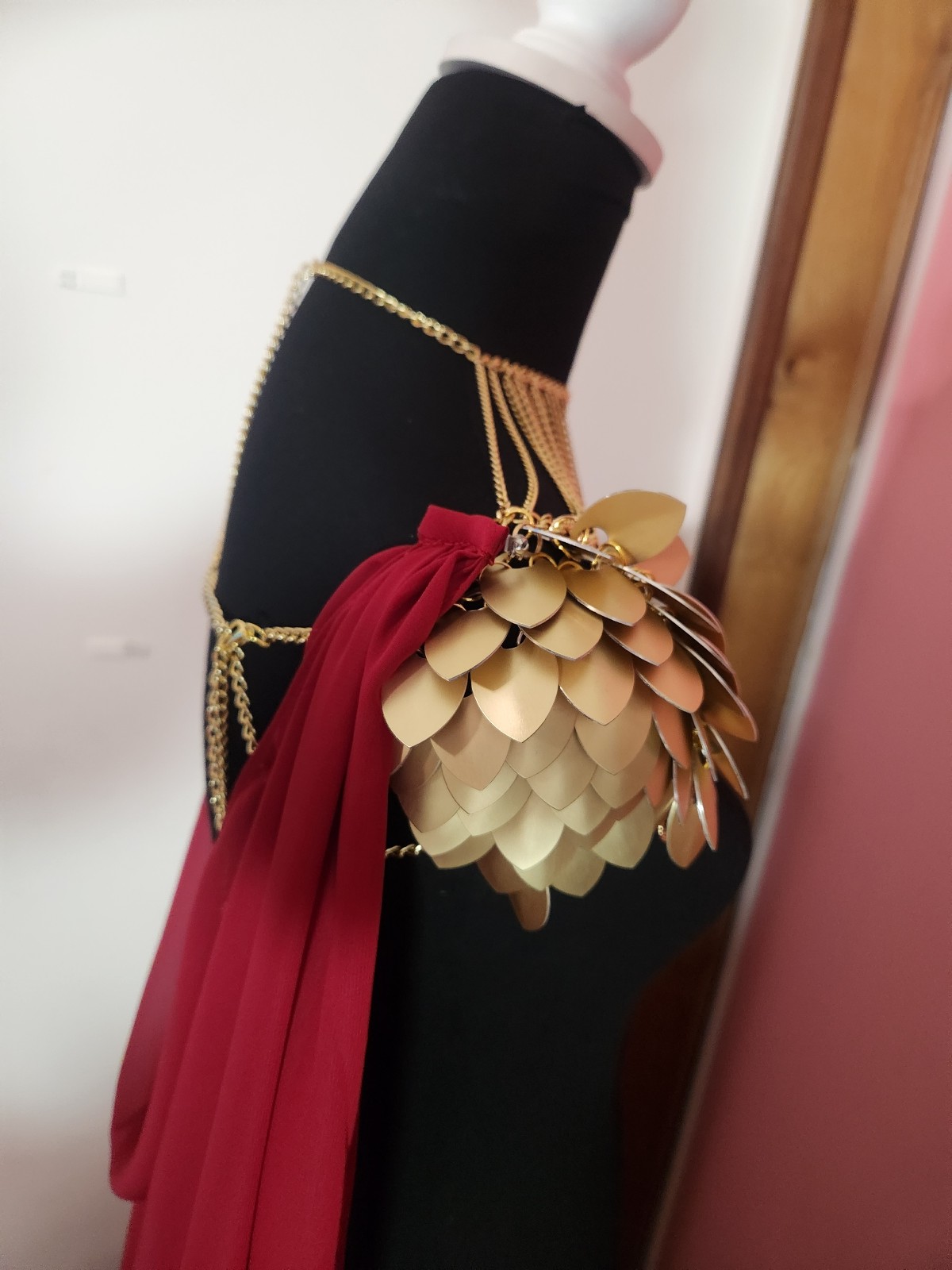 Scalemaille shoulder pauldron armor with a dark red cape / cloak