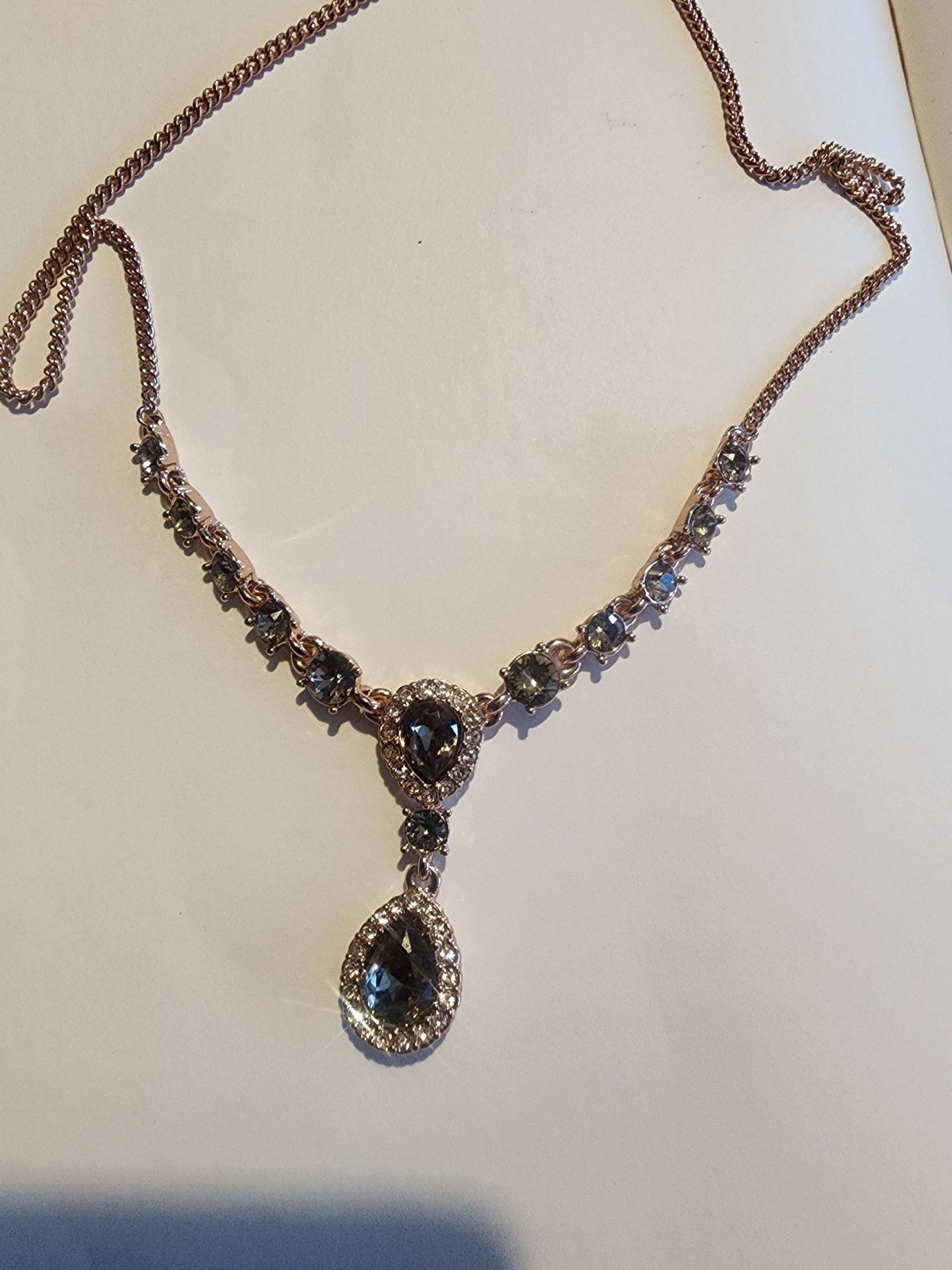 GIVENCHY GOLD TONE NECKLACE  with GREEN STONES  9 IN WITH 3 IN EXTENDER
