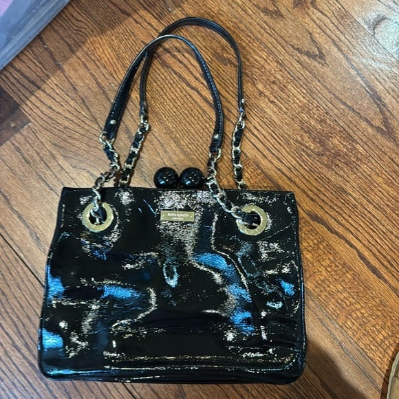 Kate Spade Darcy in black patent leather w/ gold chain and details. Has Dustbag