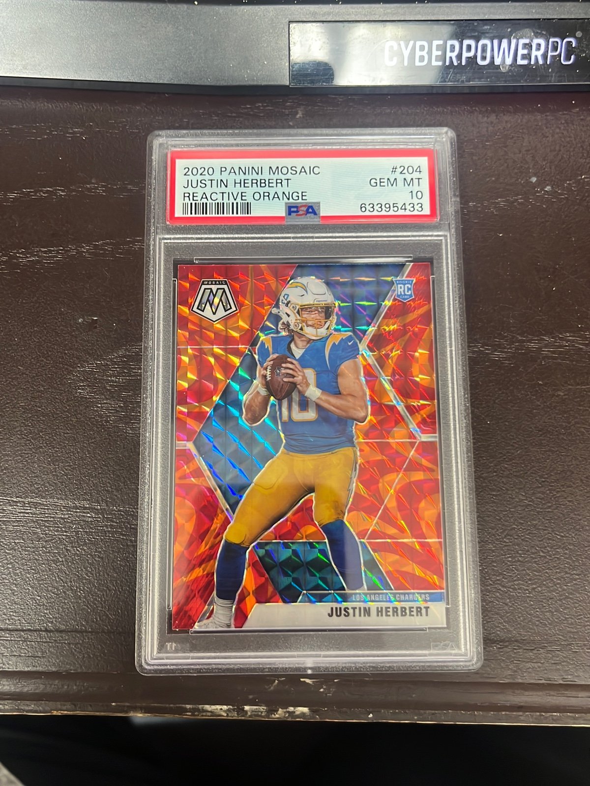 Justin Herbert Mosaic Orange Reactive PSA 10