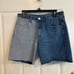 Large Bailey Rise “Check Me Out” med/light wash denim raw hem Bermuda shorts.