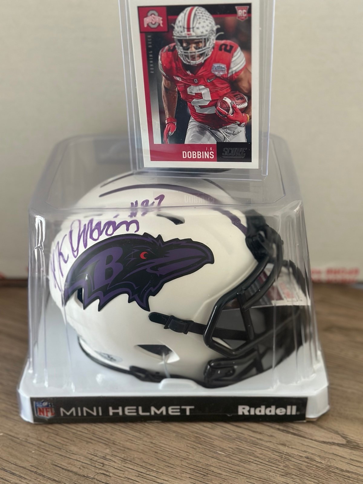 JK Dobbins autographed mini helmet with a rookie card!