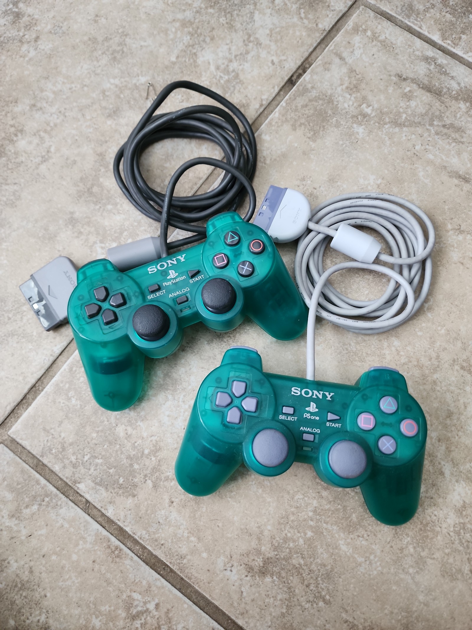 green PlayStation 1 controllers