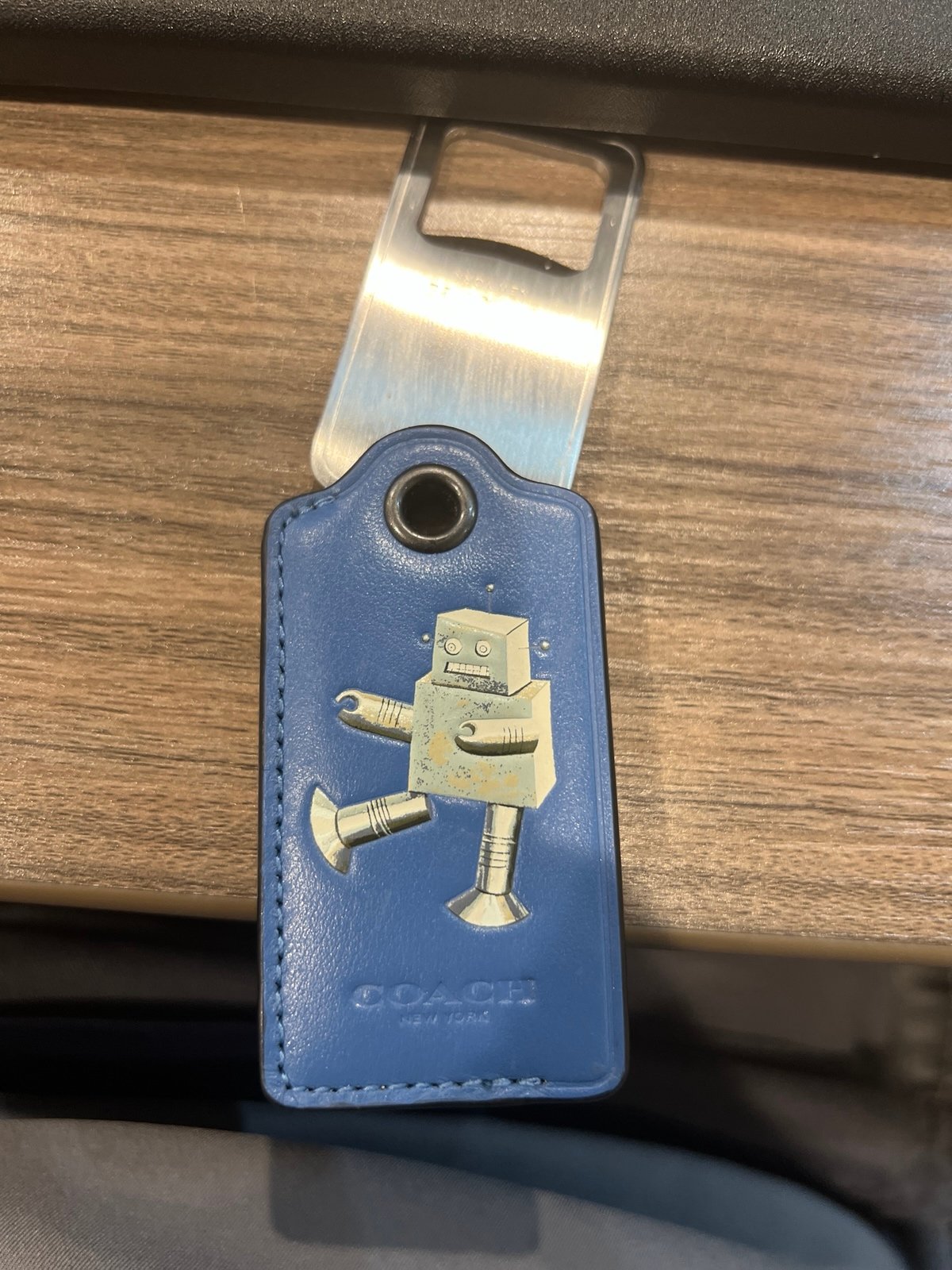 Coach bottle opener