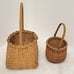 Hand Crafted Baskets (2)(One 10.25 T x 5 W x 4 D) (One 6.75 T x 5 W x 3 D)