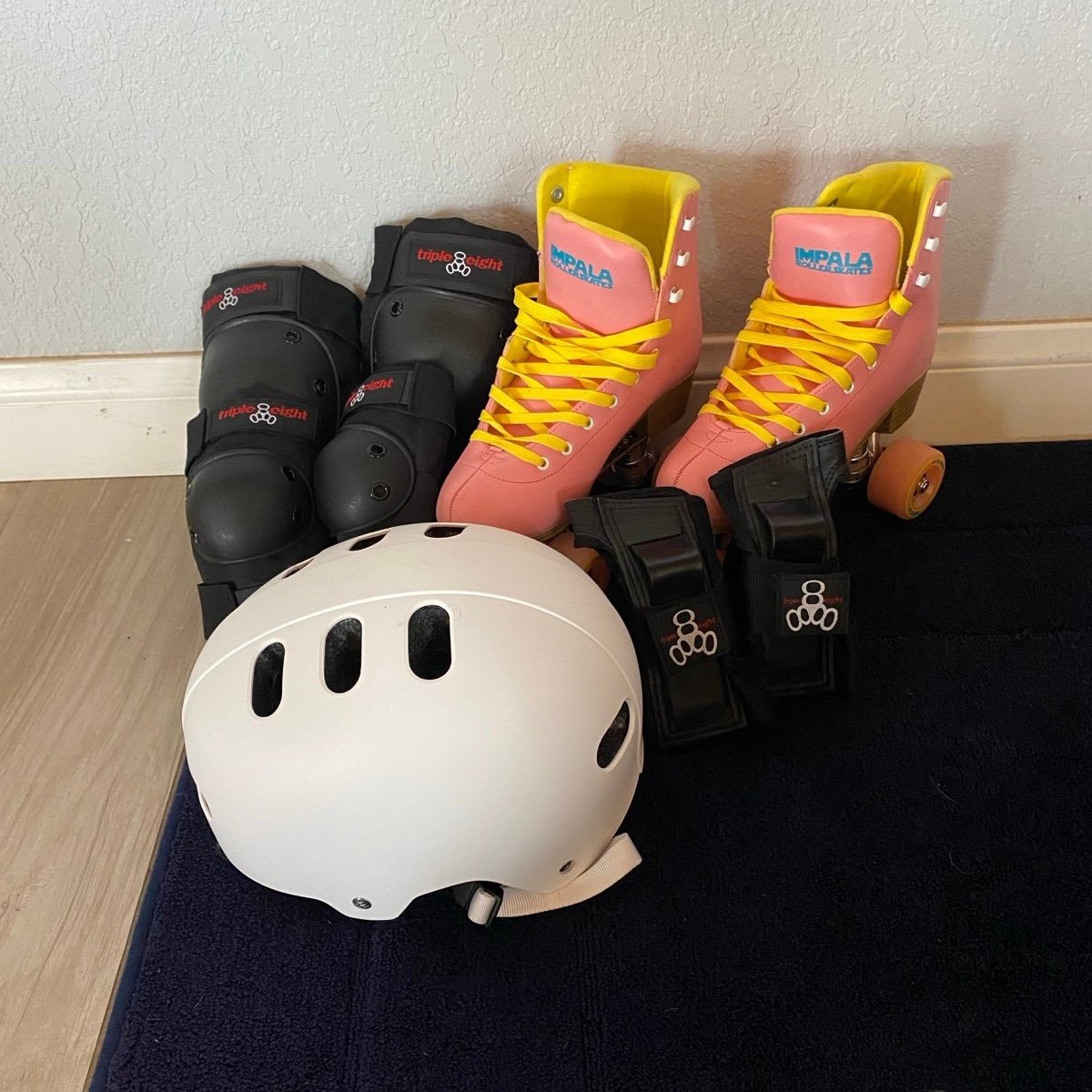 Impala roller skates with helmet, knee pads, elbow pads, and wrist guards