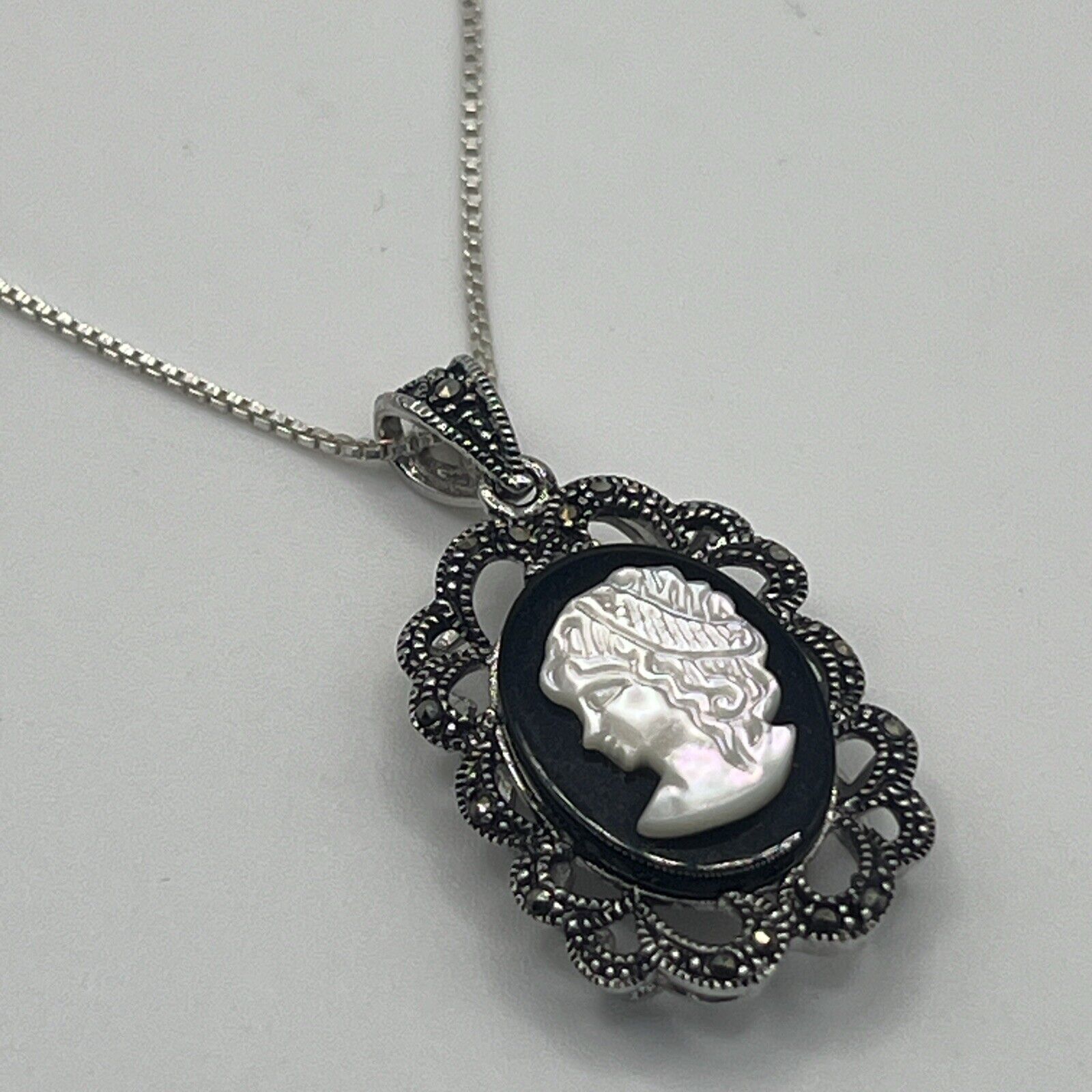 Marcasite Framed Onyx and Mother of Pearl Cameo Necklace in 925 Silver