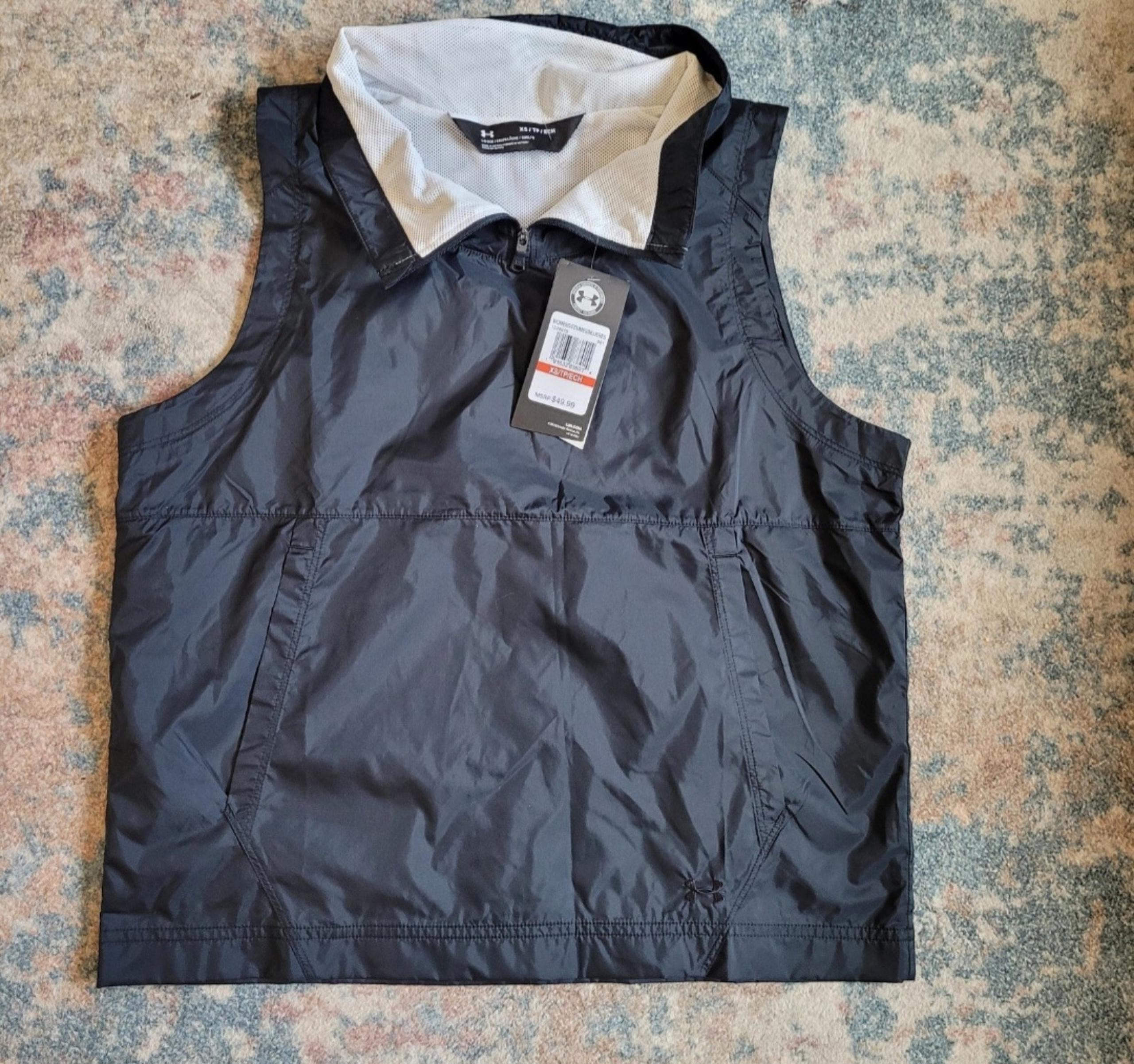Womens under armour wind breaker vest. Black. New with tags. Size XS