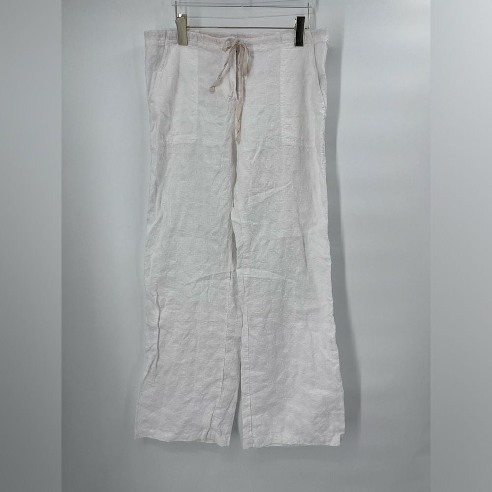 Johnny was white linen pants with embroidered pattern size large