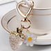 Strawberry clear sparkles gold keychain with daisy and gold heart hardware