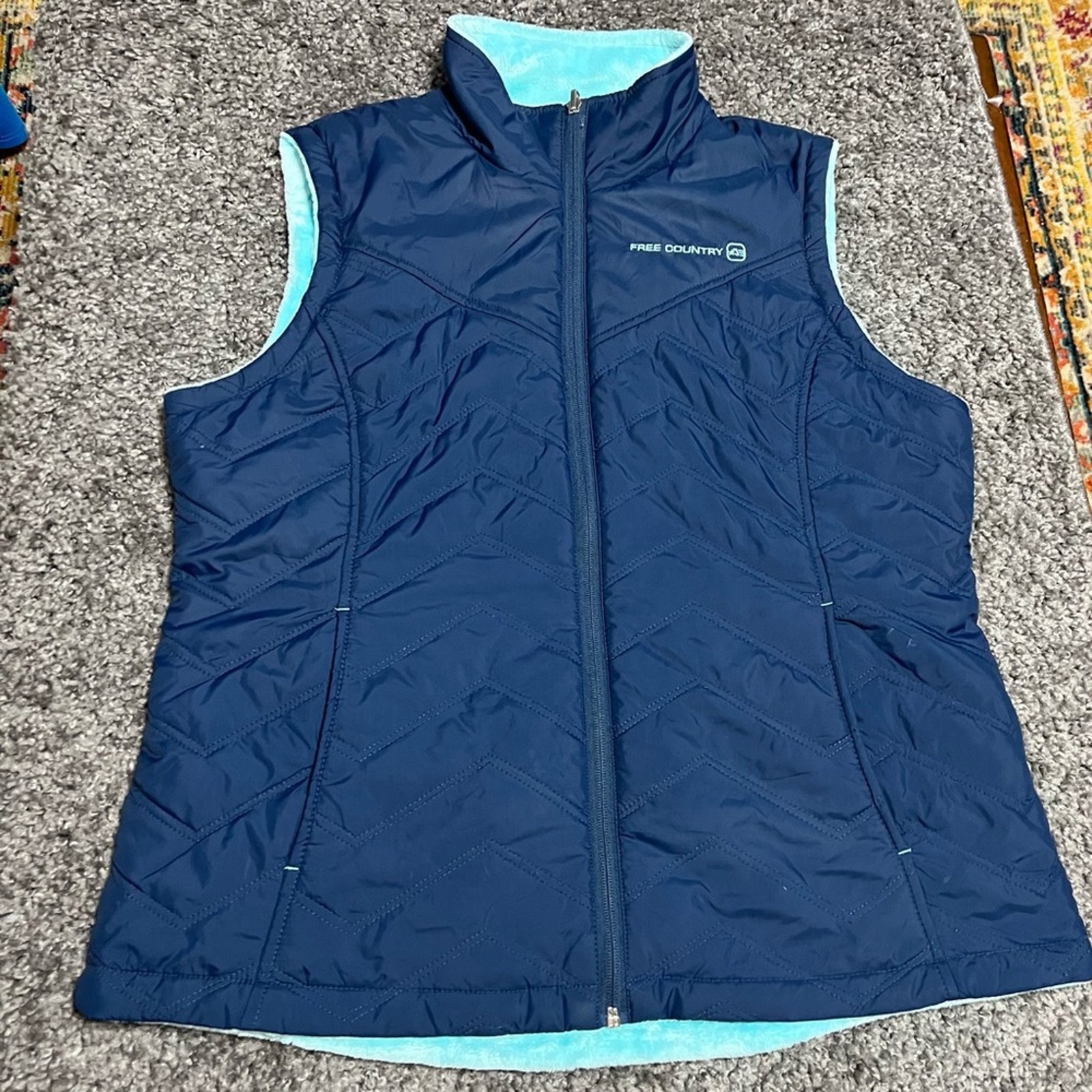 Free Country Women’s reversible vest size L, navy blue/baby blue. Pre owned