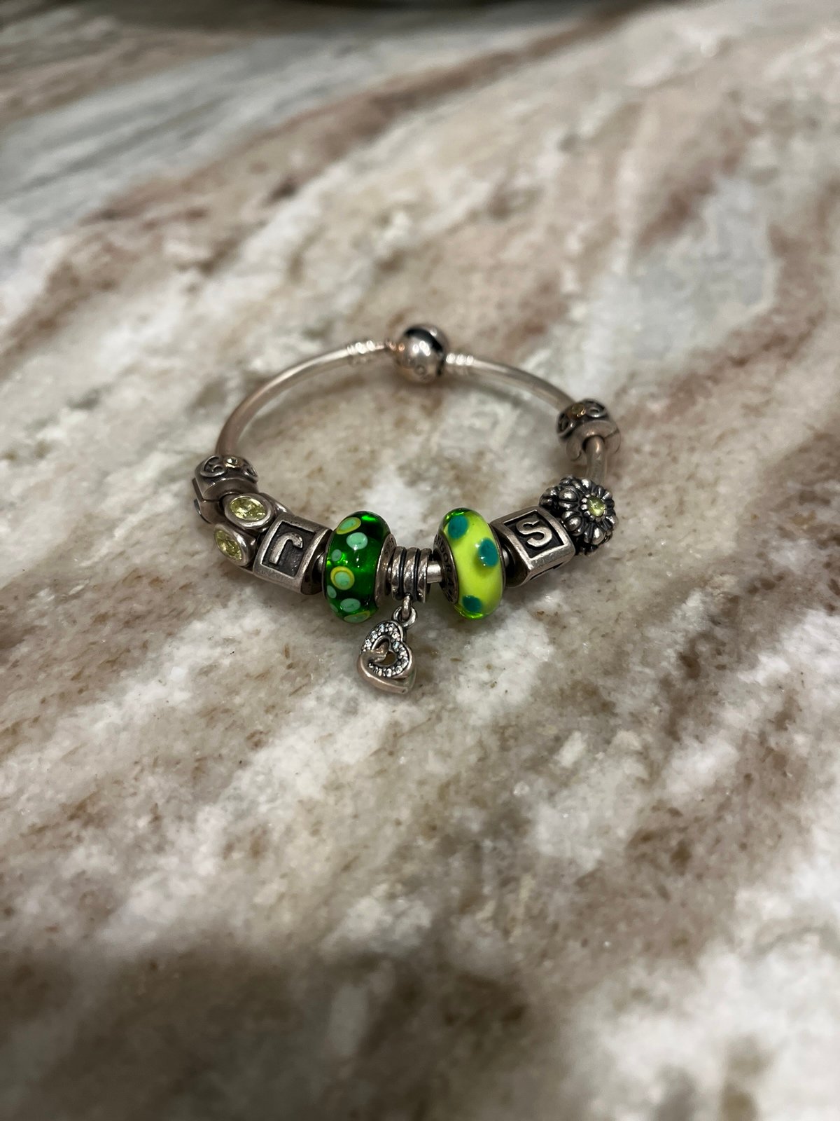 Pandora 6.5” Bracelet with 7 charms and two clips.
