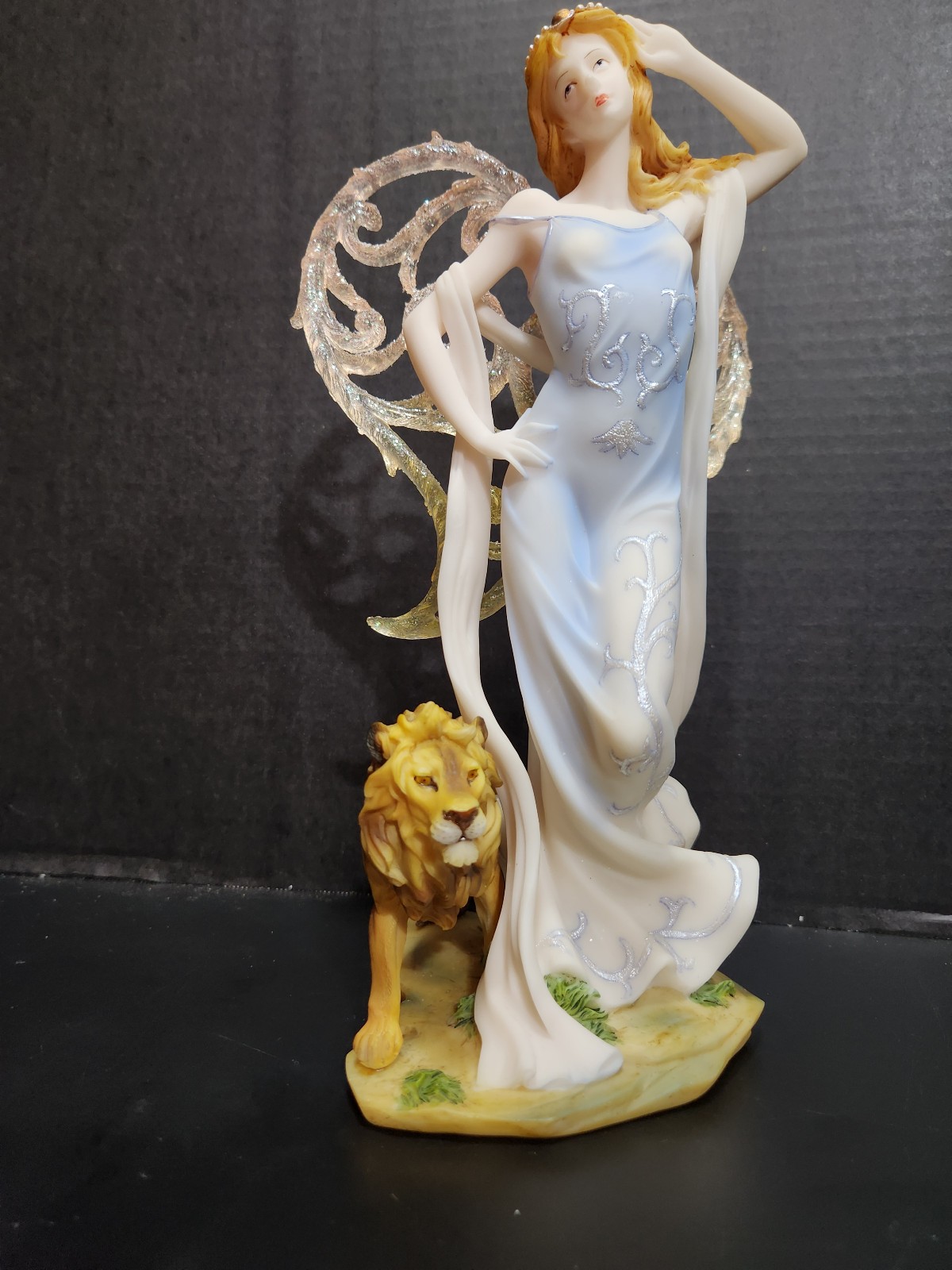 Angel fairy with lion statue