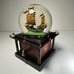 Disney Snow Globe Pirates of the Caribbean At World's End W/Key Lights Up Music