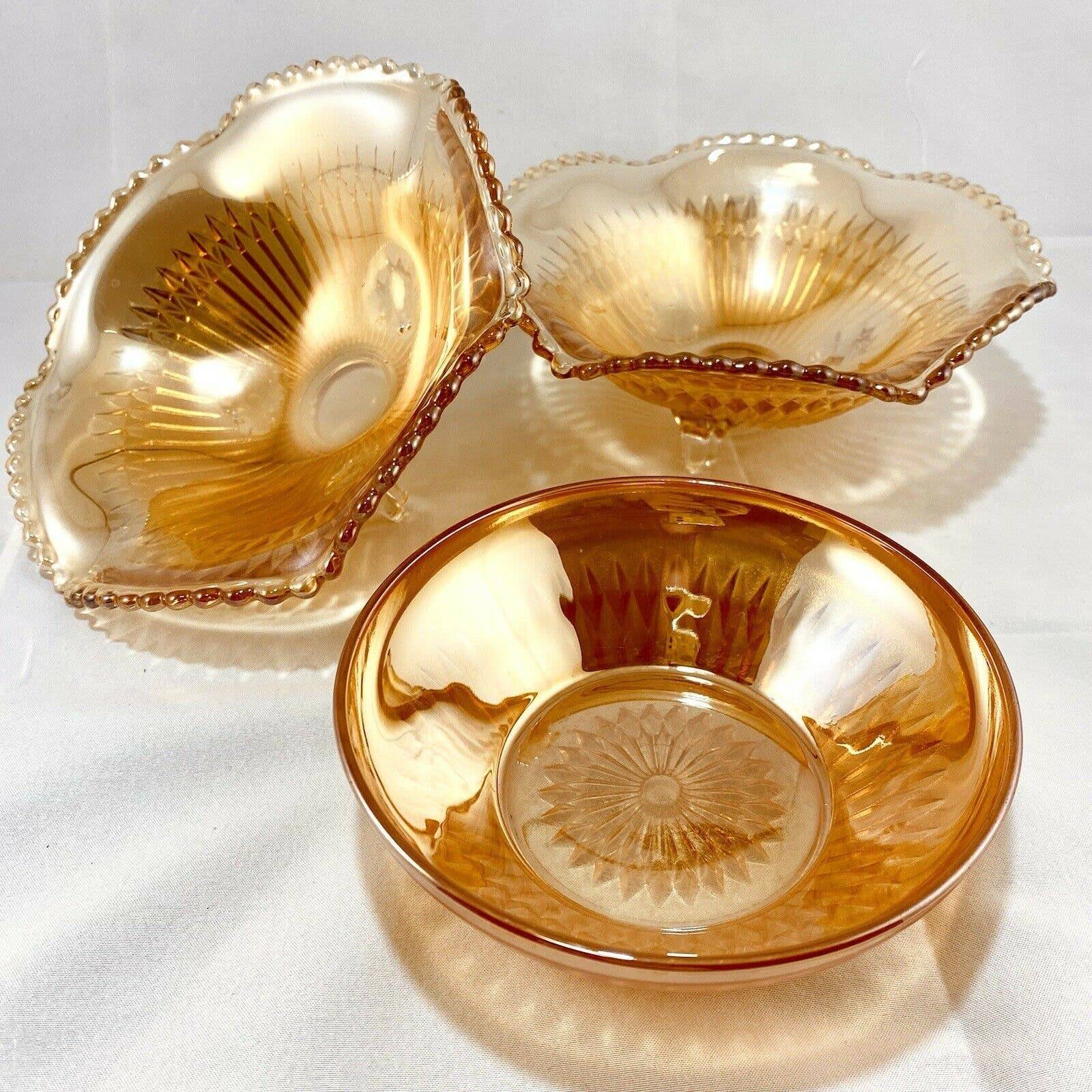 vintage orange amber iridescent carnival glass - two footed bowls, one regular