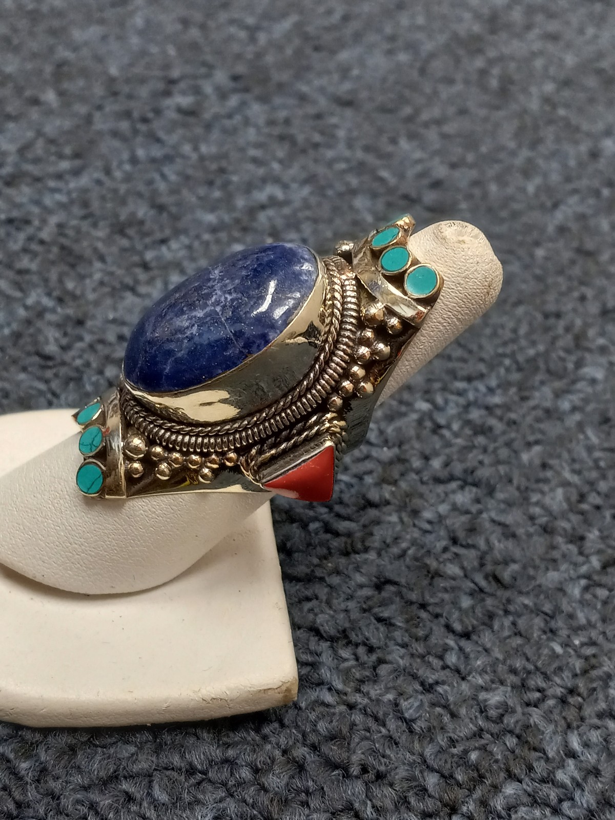 Silver lapis lazuli ring with red coral and turquoise on the