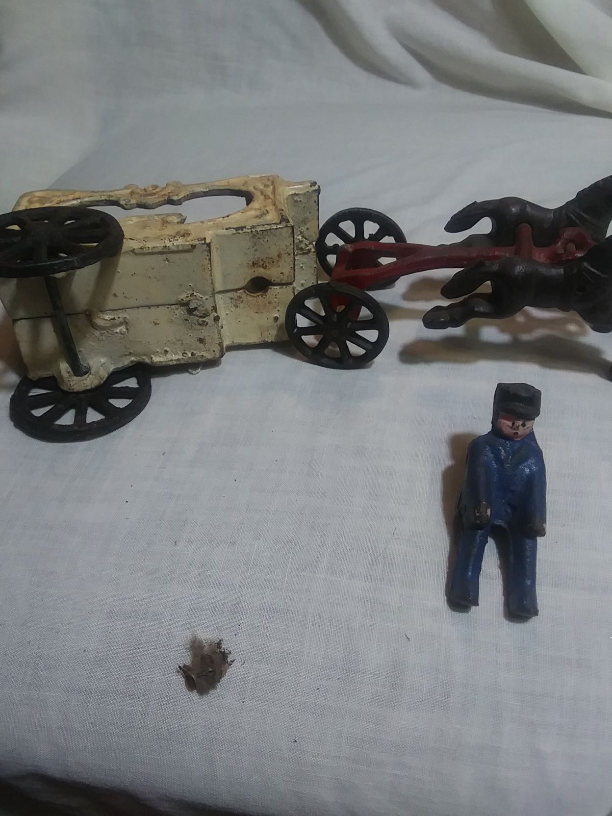 Cast iron antique you horses carriage and driver.