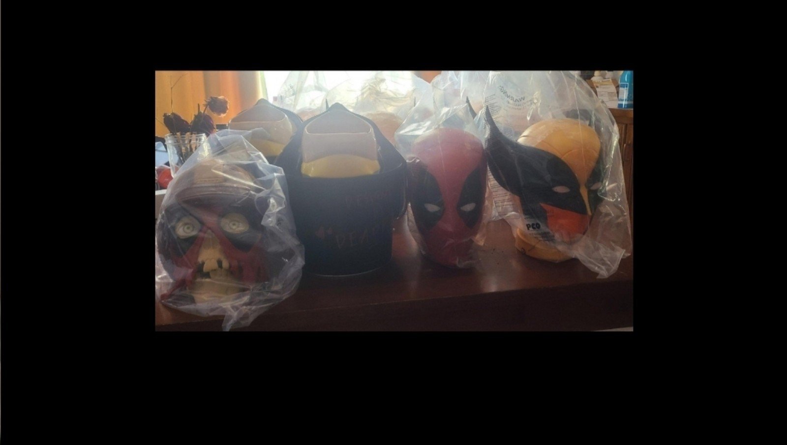 Complete set of all four different deadpool and wolverine popcorn buckets