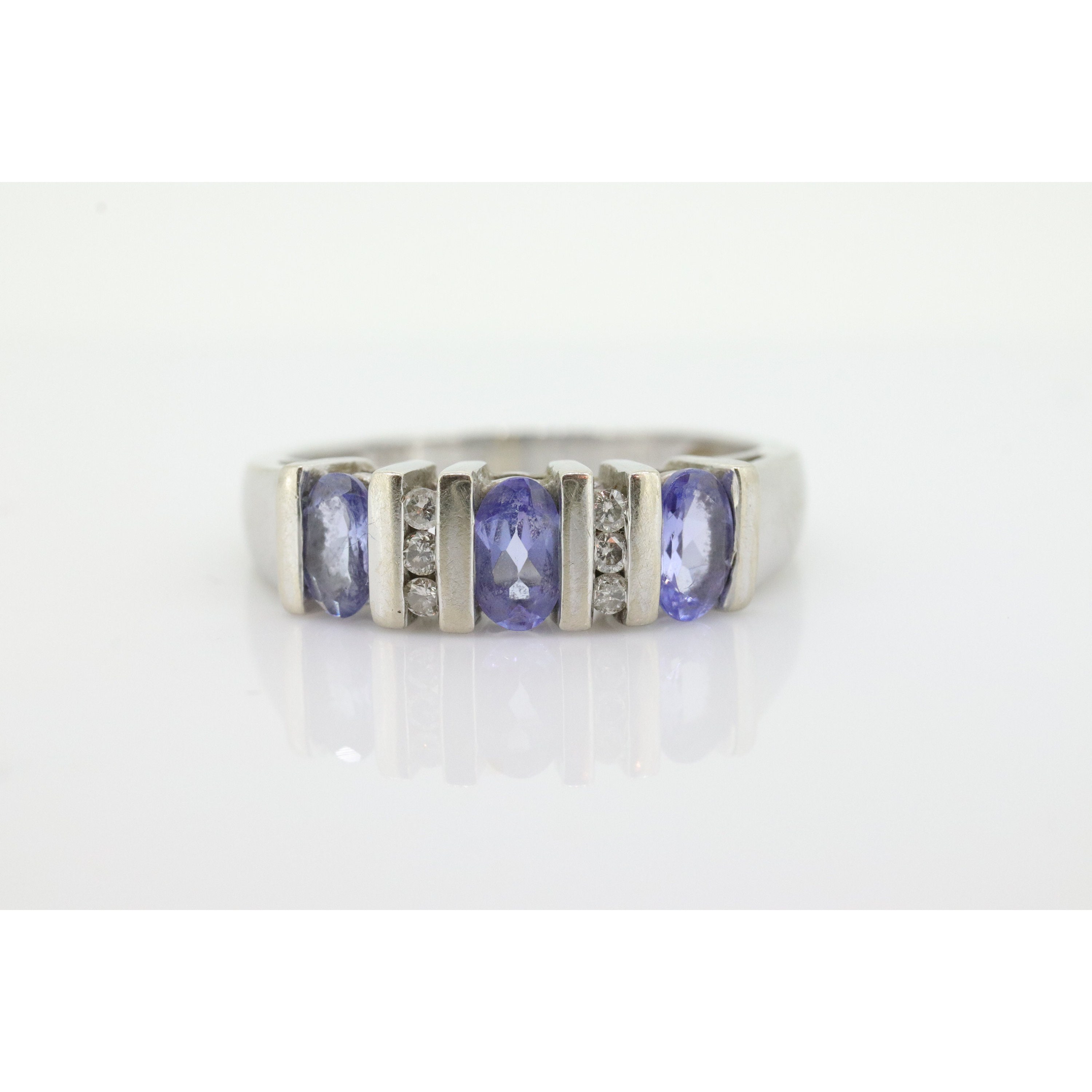 14k Tanzanite Oval and Diamond Channel Anniversary ring. Channel set eternity b