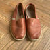 Men’s Tom’s leather slip ons.